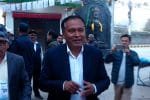Former minister Kulman Ghising casting his vote at Mahankal Janakalyan Secondary School polling center in Kathmandu during Nepal House of Representatives election.